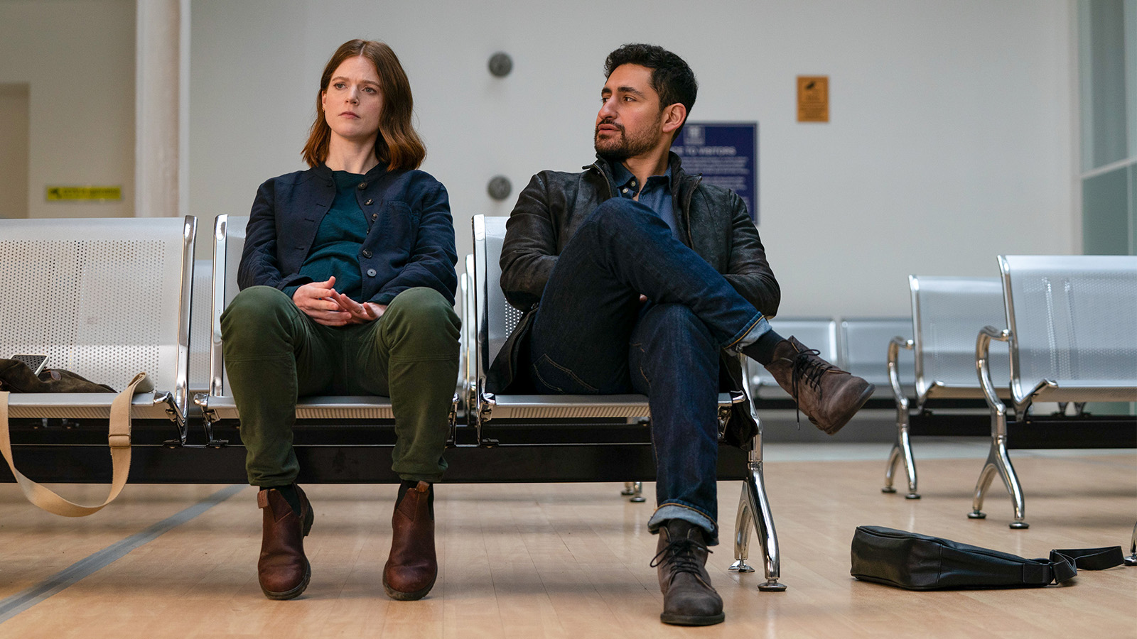 Actors Rose Leslie and Amir Al-Masry sit on a metal bench in their roles in series 2 of Vigil