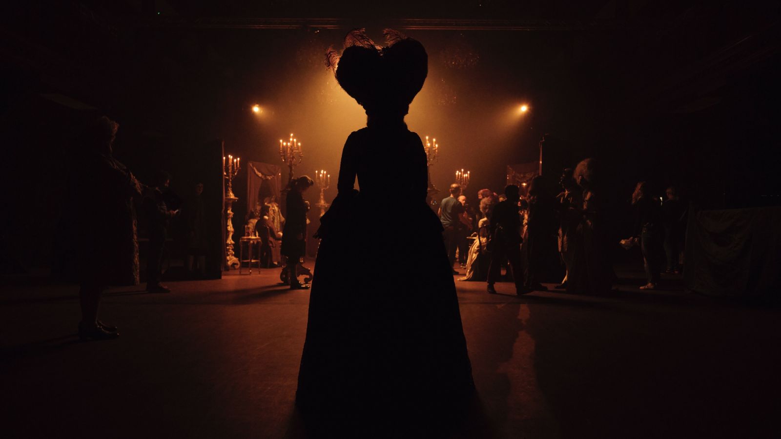 Still from Timestalker, which shows the silhouette of a woman wearing a regency gown and large wig.