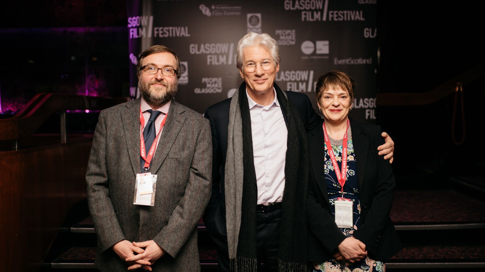 Image shows a man wearing a suit standing next to actor Richard Gere and Glasgow Film CEO Allison Gardner